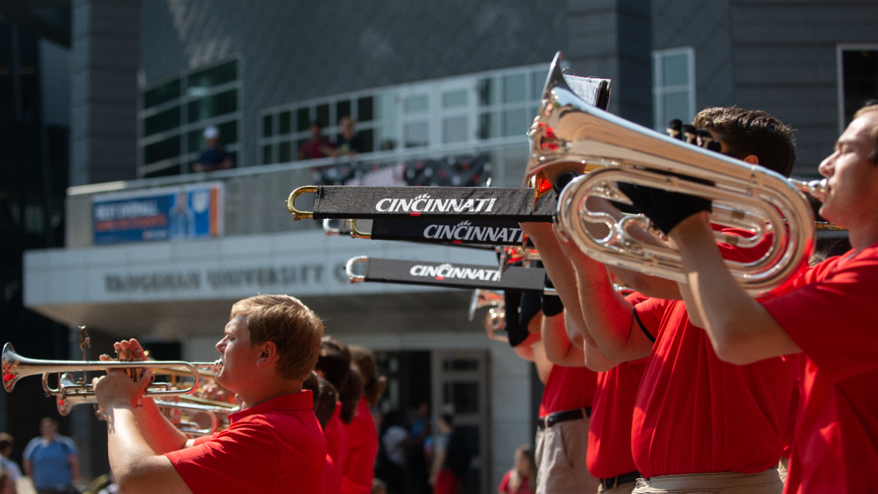 Family Weekend events around campus. The marching band performs at a pep rally on Main Street.
