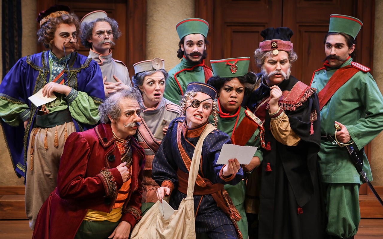 ccm-government-inspector-181002-ml-01.jpg Acting students crowd around a woman holding a letter during a performance of The Government Inspector